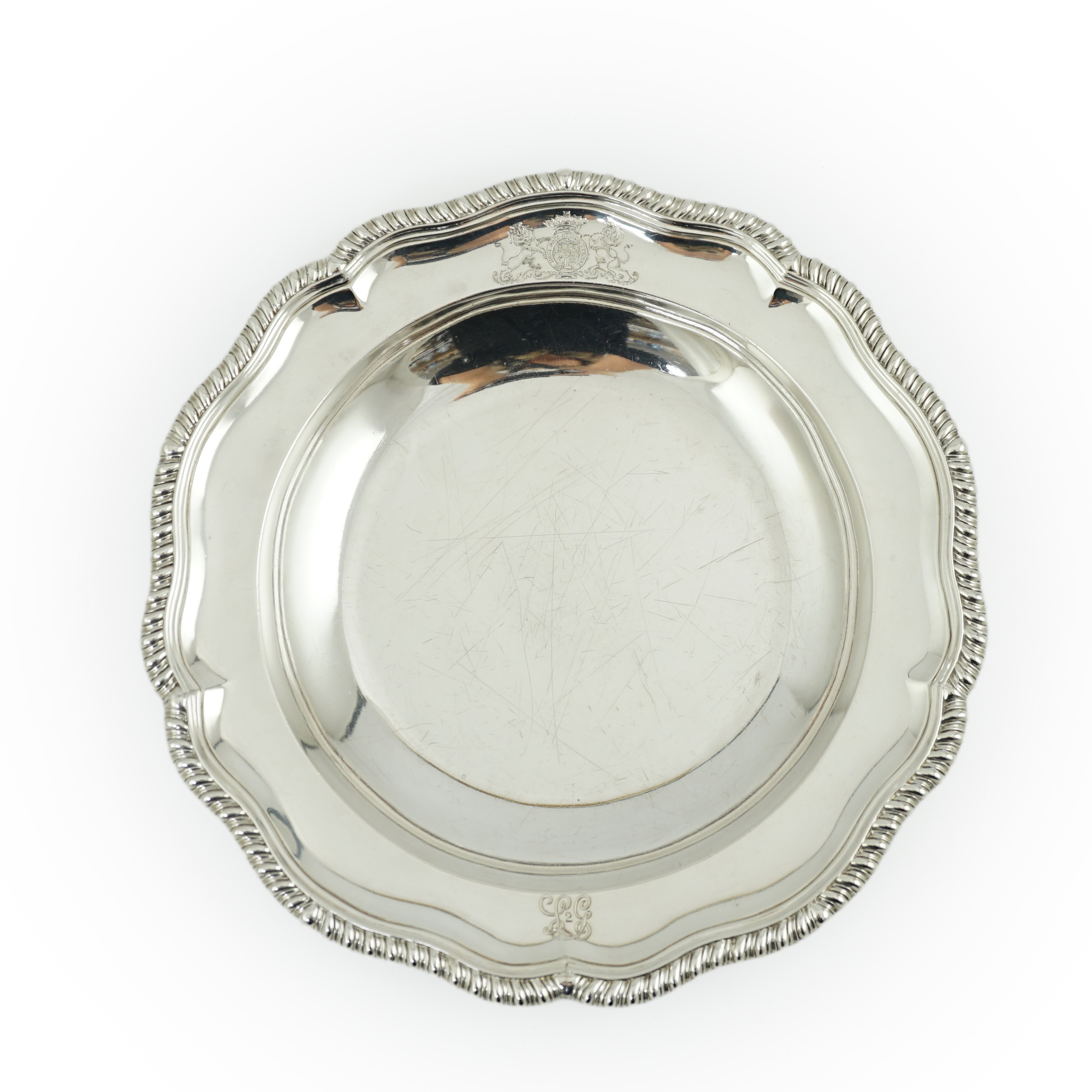 A George IV silver soup plate, by William Eaton